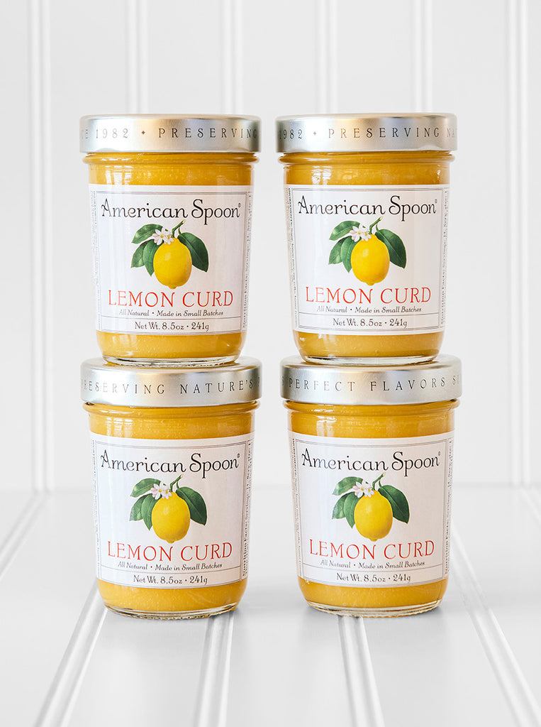 A stack of four jars of Lemon Curd