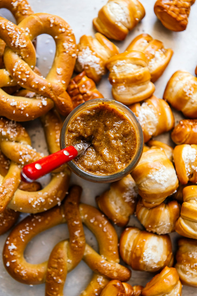 pretzels and pretzel bites round a jar of golden ale mustard