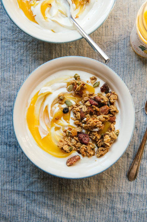 Load image into Gallery viewer, A bowl of yogurt topped with lemon curd and maple granola
