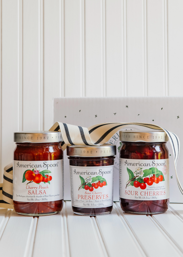 Bright collection of cherry preserves, topping, and salsa.