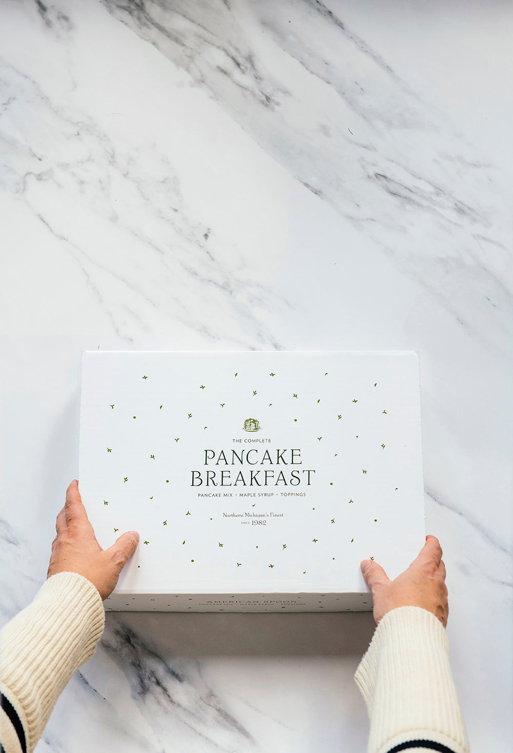 someone opening a classic pancake breakfast box