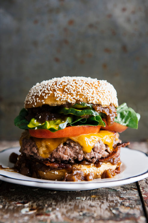 Load image into Gallery viewer, Hamburger topped with Apple &amp; Onion Jam and House Ketchup, tomatoes, cheddar cheese and lettuce
