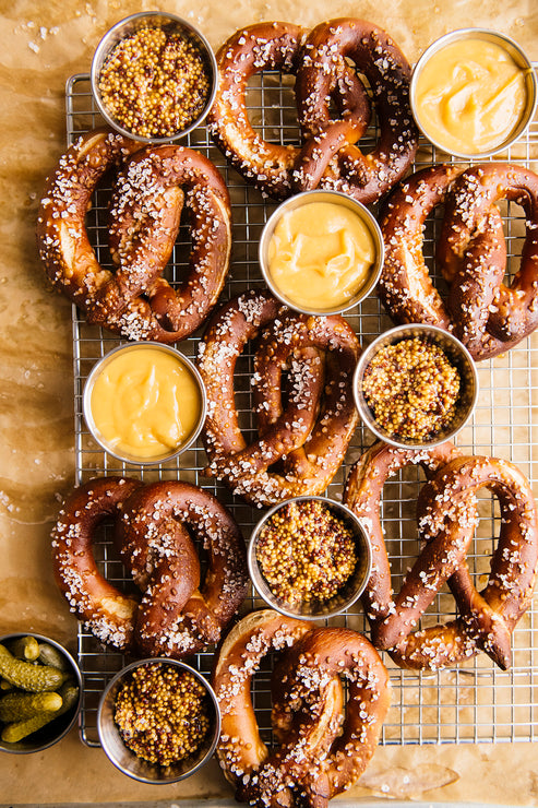 Load image into Gallery viewer, Homemade salted soft pretzels with mustard dipping sauce
