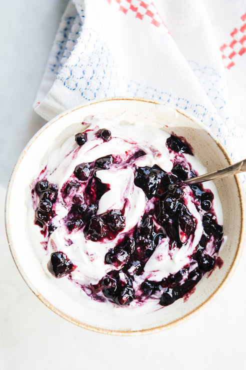 Load image into Gallery viewer, A yogurt bowl with Fruit Perfect Blueberries mixed in
