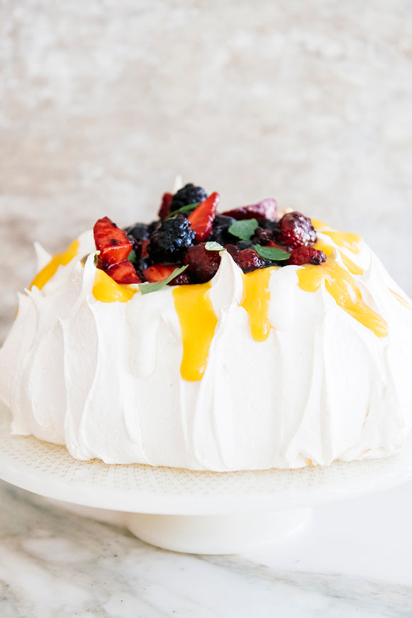 A homemade pavlova with Lemon Curd and fresh berries