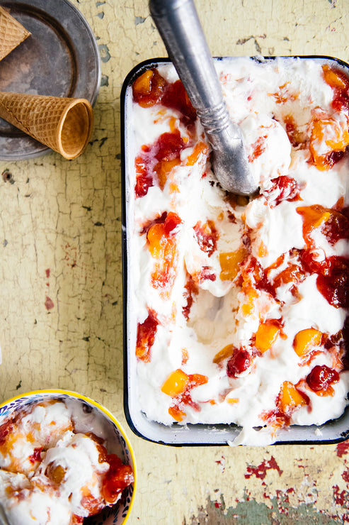 Load image into Gallery viewer, Scoops of ice cream made with fresh peaches and Red Haven Peach Preserves
