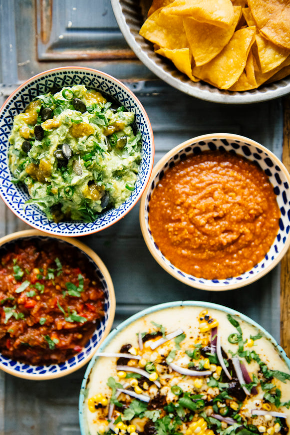 Bowls of American Spoon Salsa, Queso with Dried Chili Salsa and fresh guacamole