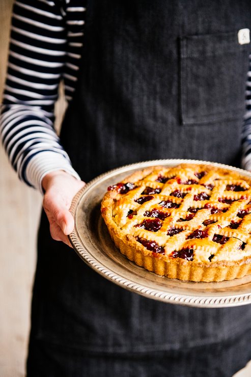 Load image into Gallery viewer, A homemade lattice pie filled with Christmas Cherries
