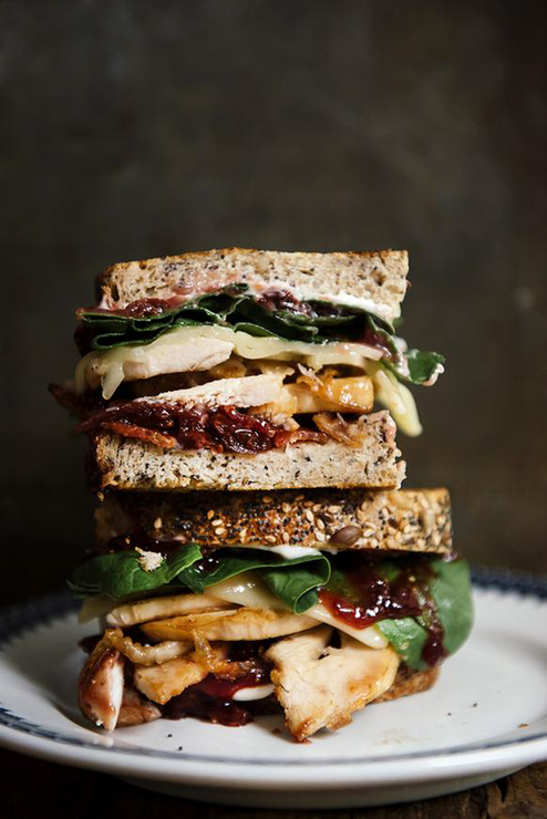 Load image into Gallery viewer, A turkey sandwich with Holiday Jam
