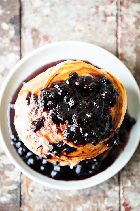 Load image into Gallery viewer, A stack of pancakes topped with Fruit Perfect Blueberries
