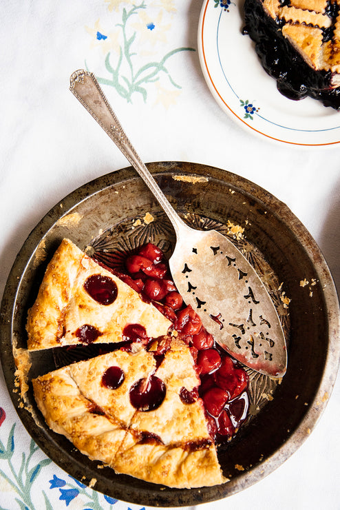 Load image into Gallery viewer, Half full pie dish of homemade cherry pie made with Fruit Perfect Sour Cherries

