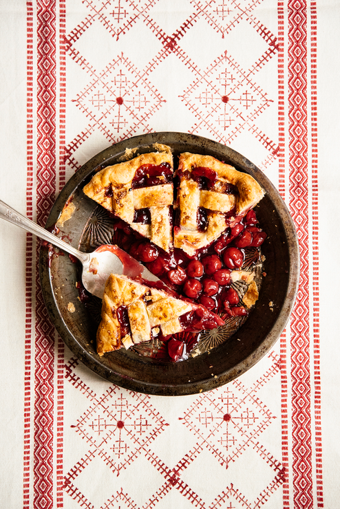 Load image into Gallery viewer, Several slices of pie in a pie dish made with Fruit Perfect Sour Cherries
