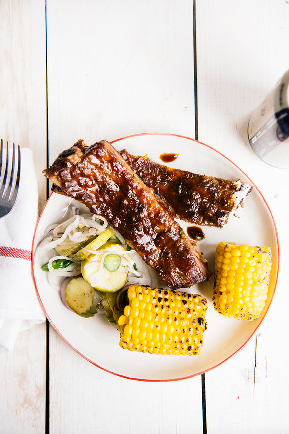 Ribs made with American Spoon Grilling Sauces with a side of corn on the cob