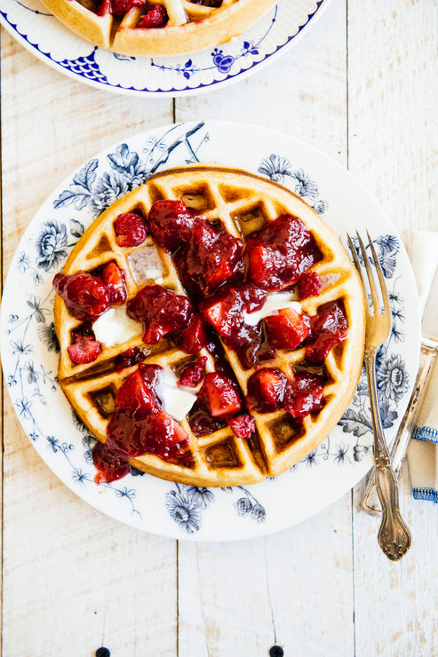 Load image into Gallery viewer, Homemade waffle topped with fresh strawberries
