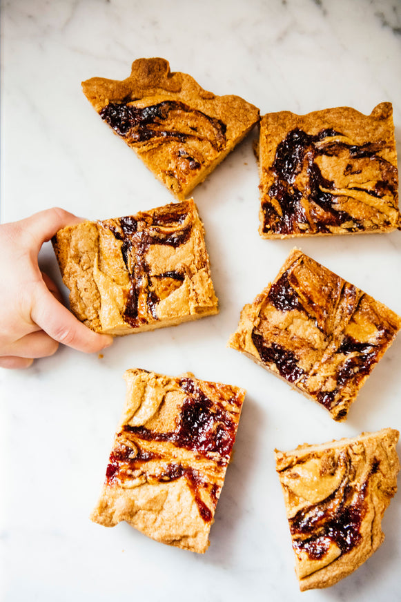 Squares of Peanut Butter and preserve blondies