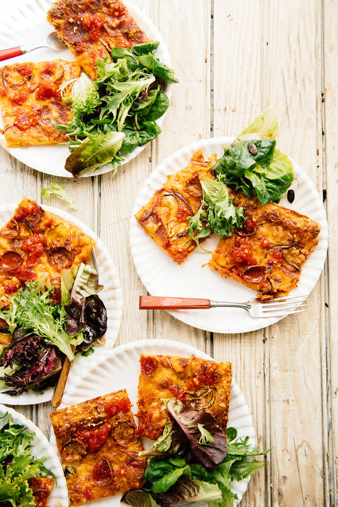 Load image into Gallery viewer, Plates of homemade pizza and salad topped with Chili Jam
