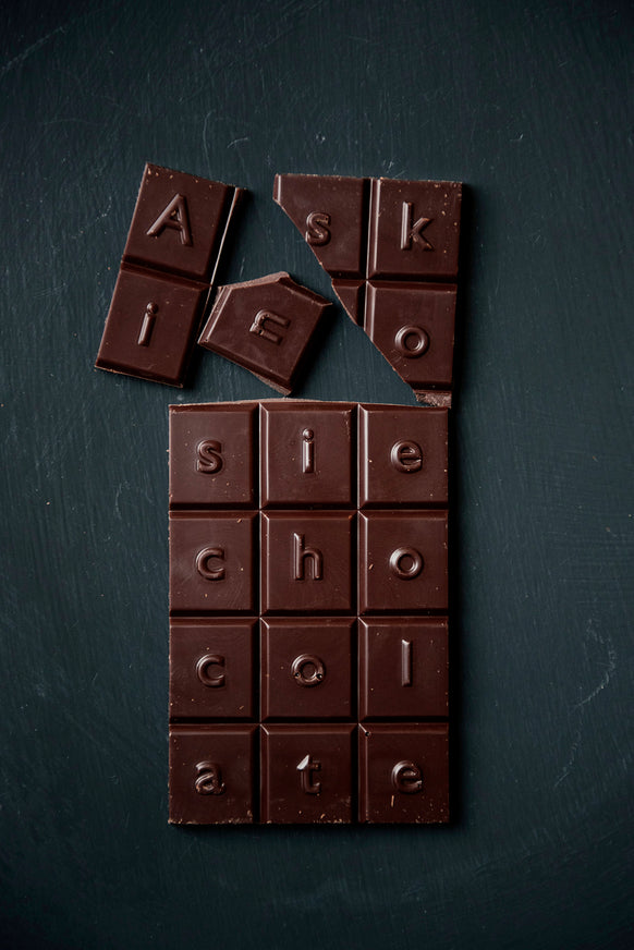 Pieces of a Dark Chocolate & Raspberry Askinosie Chocolate Bar
