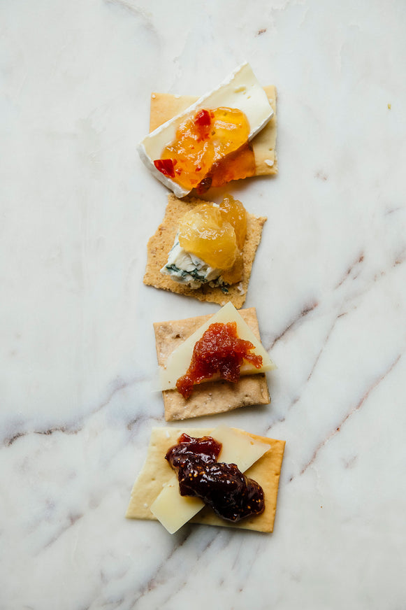 Crackers topped with brie, preserves and Jalapeno Pepper Jelly