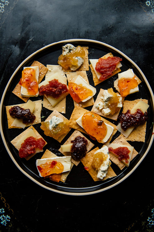 Load image into Gallery viewer, Tray of crackers topped with brie, preserves and Jalapeno Pepper Jelly
