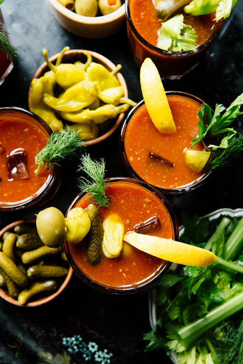 Load image into Gallery viewer, Bloody Mary&#39;s in individual glasses made with American Spoon Bloody Mary Mix, olives, pepperoncini, celery and pickles
