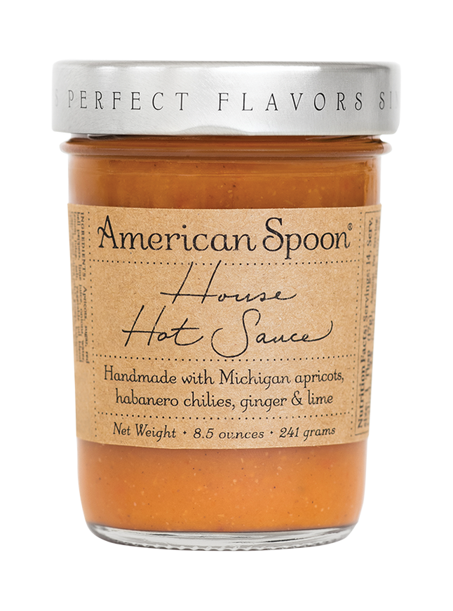 A jar of House Hot Sauce